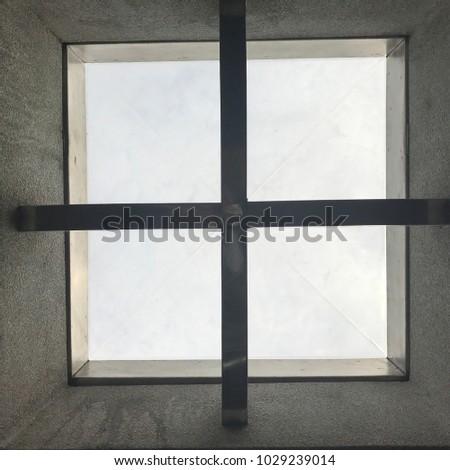 Cross sign under skylight roof