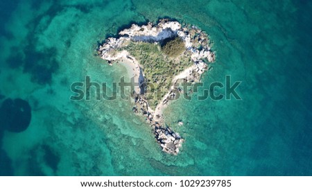 Aerial photo of tropical paradise island with turquoise and sapphire clear waters
