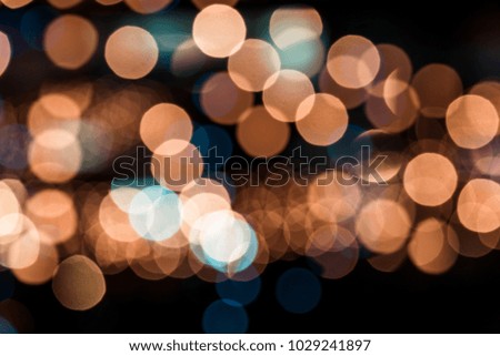 Abstract city light bokeh background. Orange and blue colours. 