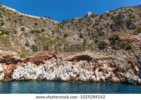 Shipyard and the ruins of a medieval fortress on the mountainside in Alanya, Turkey
