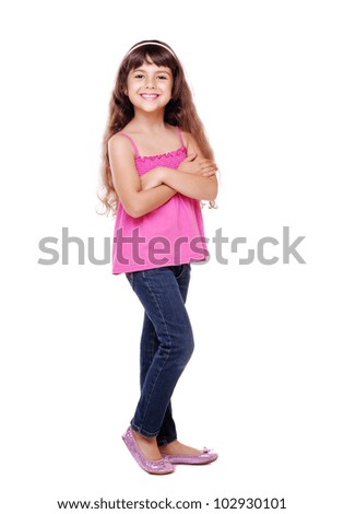 Full length portrait of a little girl standing with folded hands over white background