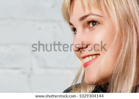 Young woman showing smile in casual smart clothing isolated against white background