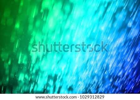 Abstract Colorful blue and green sparkle meteor comet background