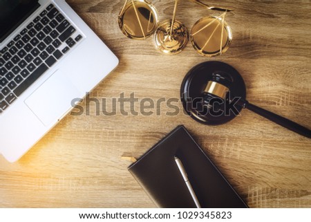 working space of lawyer with law gavel ,laptop ,legal book and brass scale of judge. lawyer and law ,judiciary and legislature courtroom legal concept. top view flatlay lawyer background.