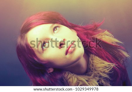    emo girl with red hair on  gray background