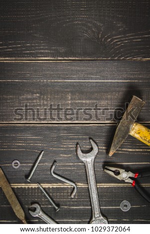 Joinery tools on a dark wooden table. Place for the text. A concept for Father's Day. Top view. Flat laying.