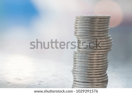 Money and saving concept. Close up of stack of silver coins.
