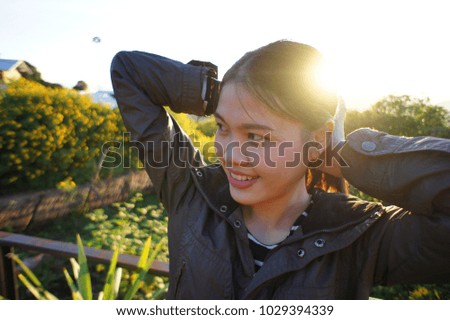 The girl with a light morning. In the village with yellow flowers, Ban Mae Kham, Chiang Rai.