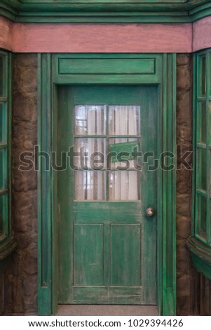 Green door with a close sign on the door