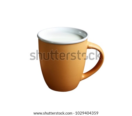 mug of clay brown color. inside poured healthy milk. isolate on white background.