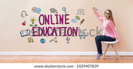 Online Education with young woman holding a pen in a chair