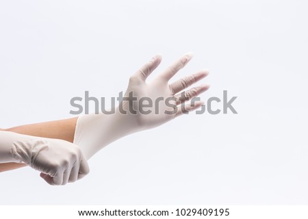 Human holding Variation of Latex Glove, Rubber glove manufacturing, human hand is wearing a medical glove, glove