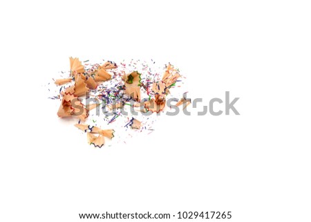 pile of colorful pencil shavings isolated on a white paper