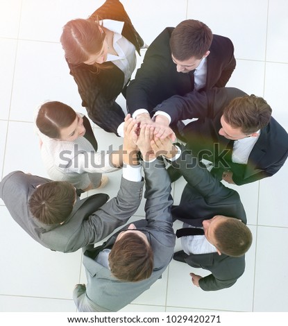 view from the top.Business people holding hands.