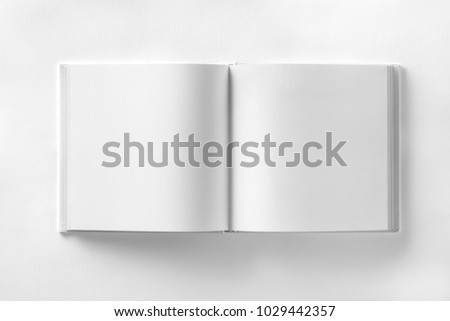 Mockup of opened blank square book at white design paper background. Royalty-Free Stock Photo #1029442357