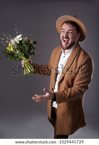 man in a hat with flowers