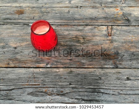 Romantic red candle on a wooden table in a lovely restaurant in Muenster in Westphalia, Germany
