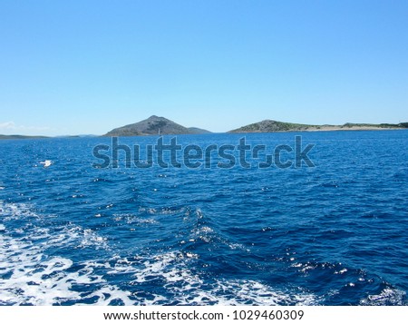 Sea water ship trail with white foamy wave. Tropical islands ferry travel. Bubble tail after cruise ship. Deep ocean view. Big ship pitching image. White water wave in the sea.
