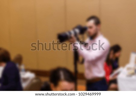 photographer holding camera blurred blur