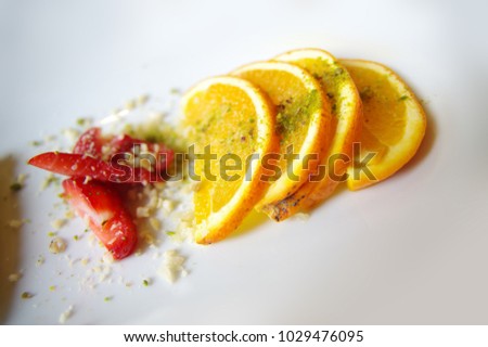 oranange pieces and strawberry pieces isolated