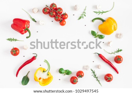 Healthy food on white background. Vegetables, tomatoes, peppers, green leaves, mushrooms. Flat lay, top view, copy space Royalty-Free Stock Photo #1029497545