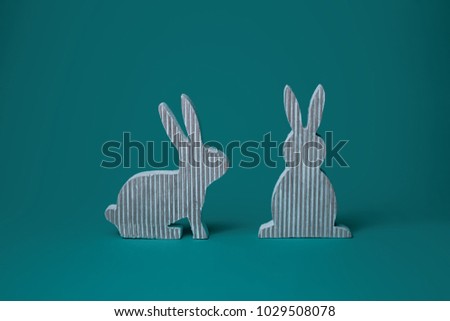 Two striped rabbits,Easter decor for home on color background