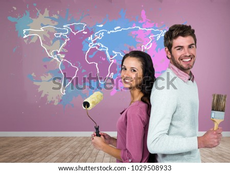 Digital composite of Couple painting a Colorful Map with paint splattered wall background