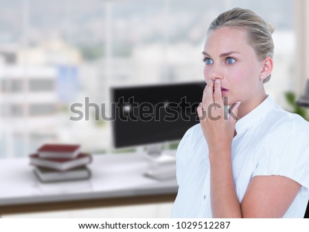 Digital composite of Business woman scared in the office desk