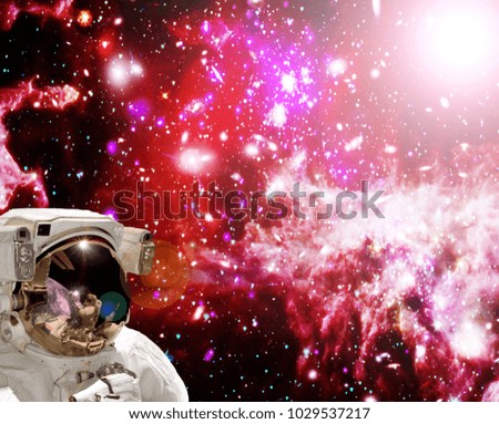 Closeup of astronaut. Deep space and galaxies. The elements of this image furnished by NASA.
