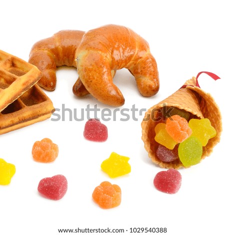 Croissants, waffles and marmalade isolated on white background