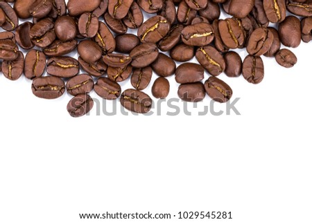 Closeup of coffee beans on white background. Copy space.