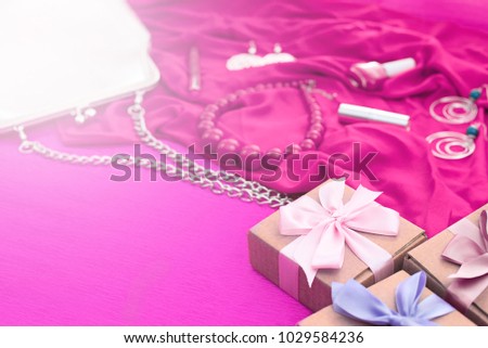 Gifts Packed in Kraft boxes tied with satin ribbon. A set of women's accessories and cosmetics.