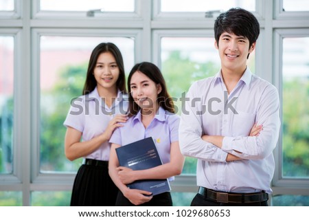 Group of Asian student in Thai university stand in library, this immage can use for education, school and back to school concept Royalty-Free Stock Photo #1029680653