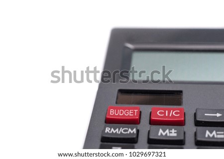 Close up shot of a Calculator isolated over white background.Text BUDGET written on calculator's button.