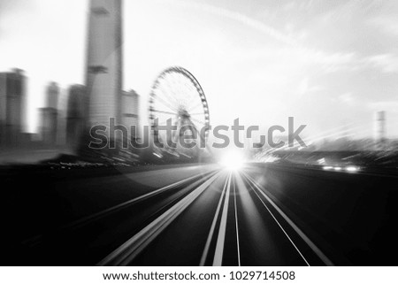 Creative image of moving train on city with black and white tone