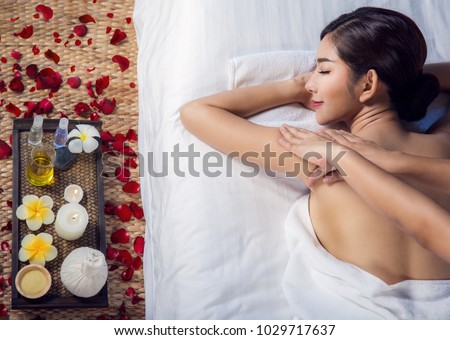 Asian lady relax with masage and spa in resort, this photo can use for skin care, spa, massage, healthy, holiday and relax concept