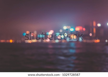 Blur image of Hong Kong night view with circle bokeh in vintage style