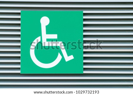 Disabled symbol with the green background