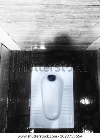Top down of toilet bowl in restroom 