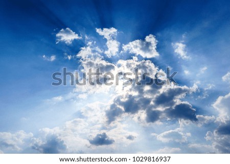 Light rays are shining through the clouds