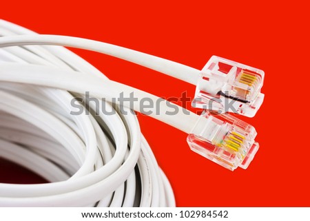 Macro of telephone cable - on red background