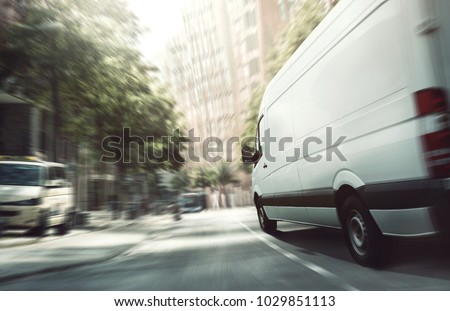 Delivery van in the city Royalty-Free Stock Photo #1029851113