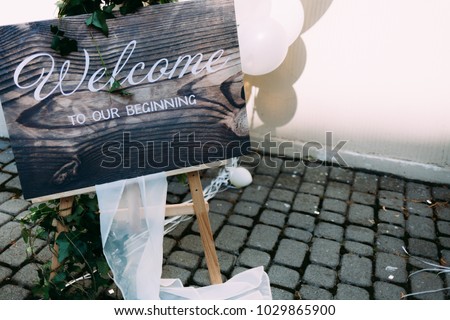 Text on the desk "Welcome to our beginning"