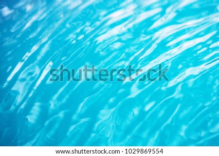 The smooth natural green blue water background with bokeh  abstract on the sea or ocean,vintage and soft colored blur.

