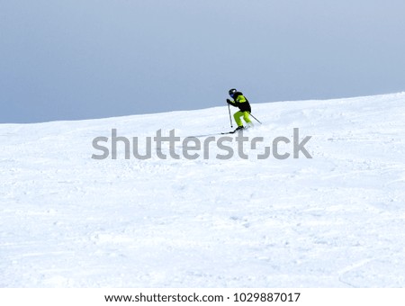 Mountain skiing, child boy skiing down the mountain