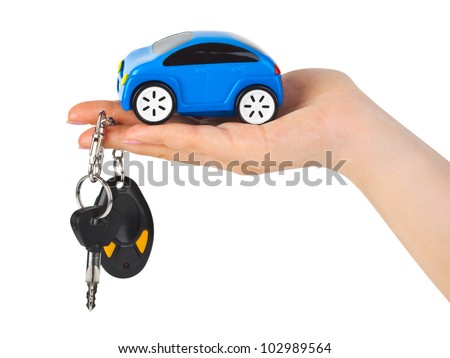 Hand with keys and car isolated on white background
