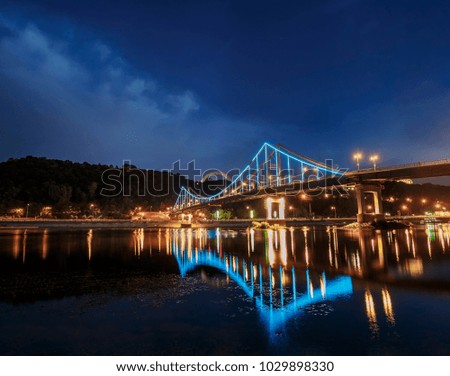 Park bridge in the evening over the Dnieper in Kyiv, Ukraine