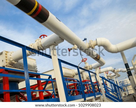 Pipes over Gasoline air coolers. Oil refinery. Equipment for primary oil refining.