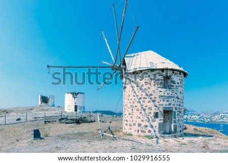 Row of Traditional restored windmills on top of Bodrum hill overlooking Bodrum and Gumbet.