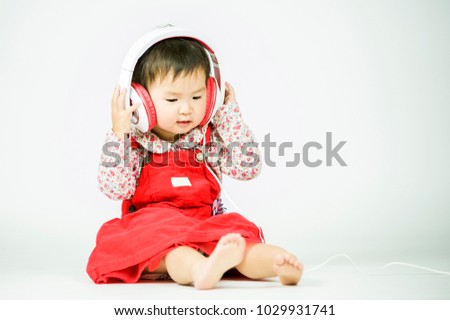 Children listen to music on a white background